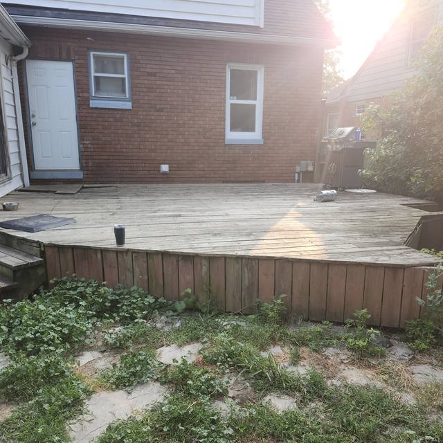 Back yard: old deck before, regraded yard with new steps after (before) — Coghill Construction & Renovations