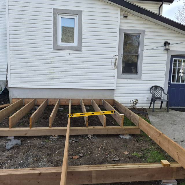 Backyard deck: framing before, finished deck with privacy screen after (before) — Coghill Construction & Renovations